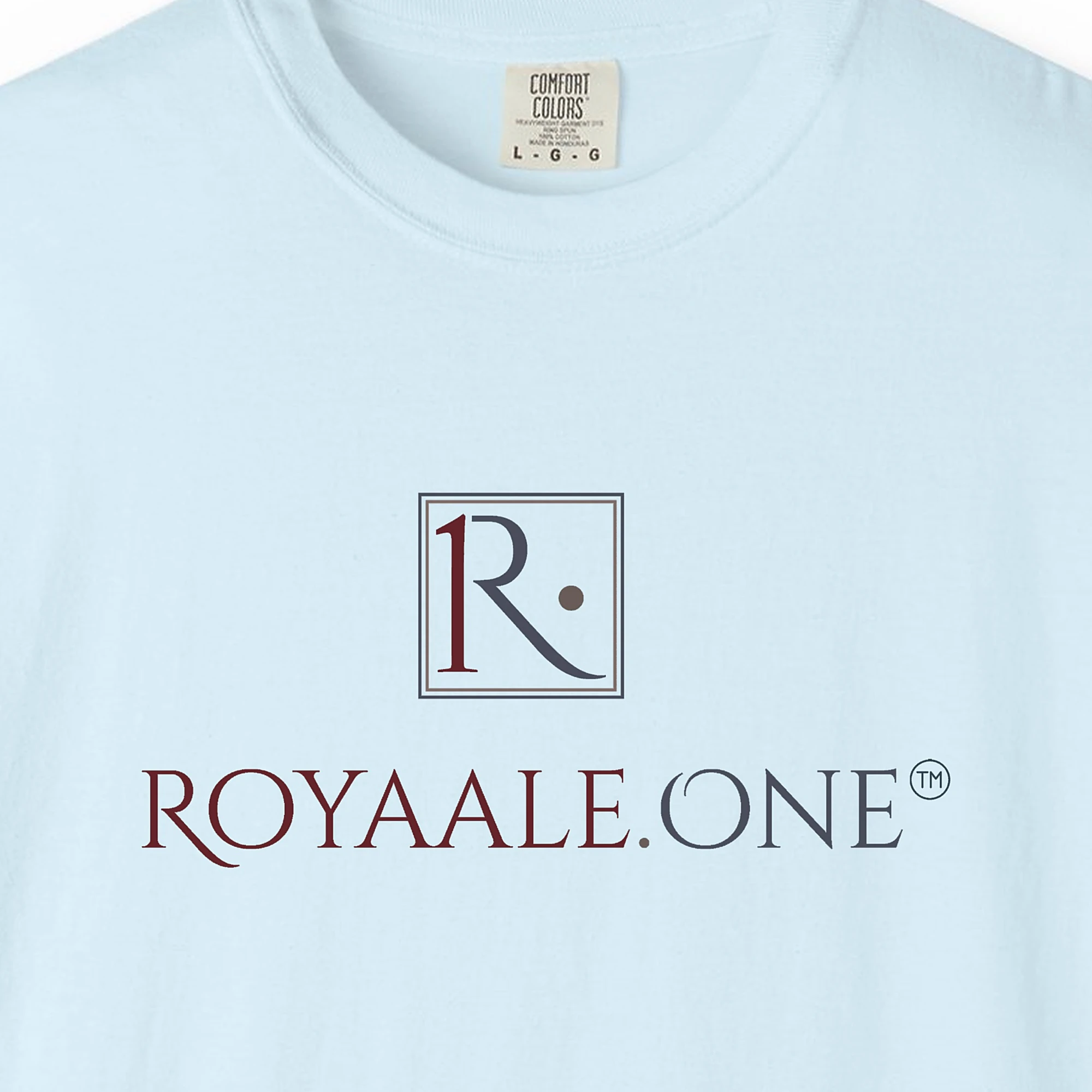 royaale-one-wordmark-tee-chambray-chest Close-up of the Royaale.One Wordmark print on a Chambray Comfort Colors 1717 tee