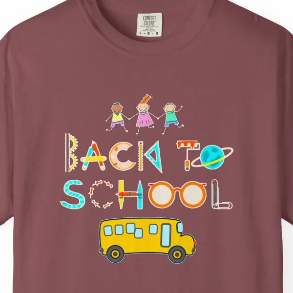 Close-up of the School Bus Friends print on a Brick Comfort Colors 1717 tee