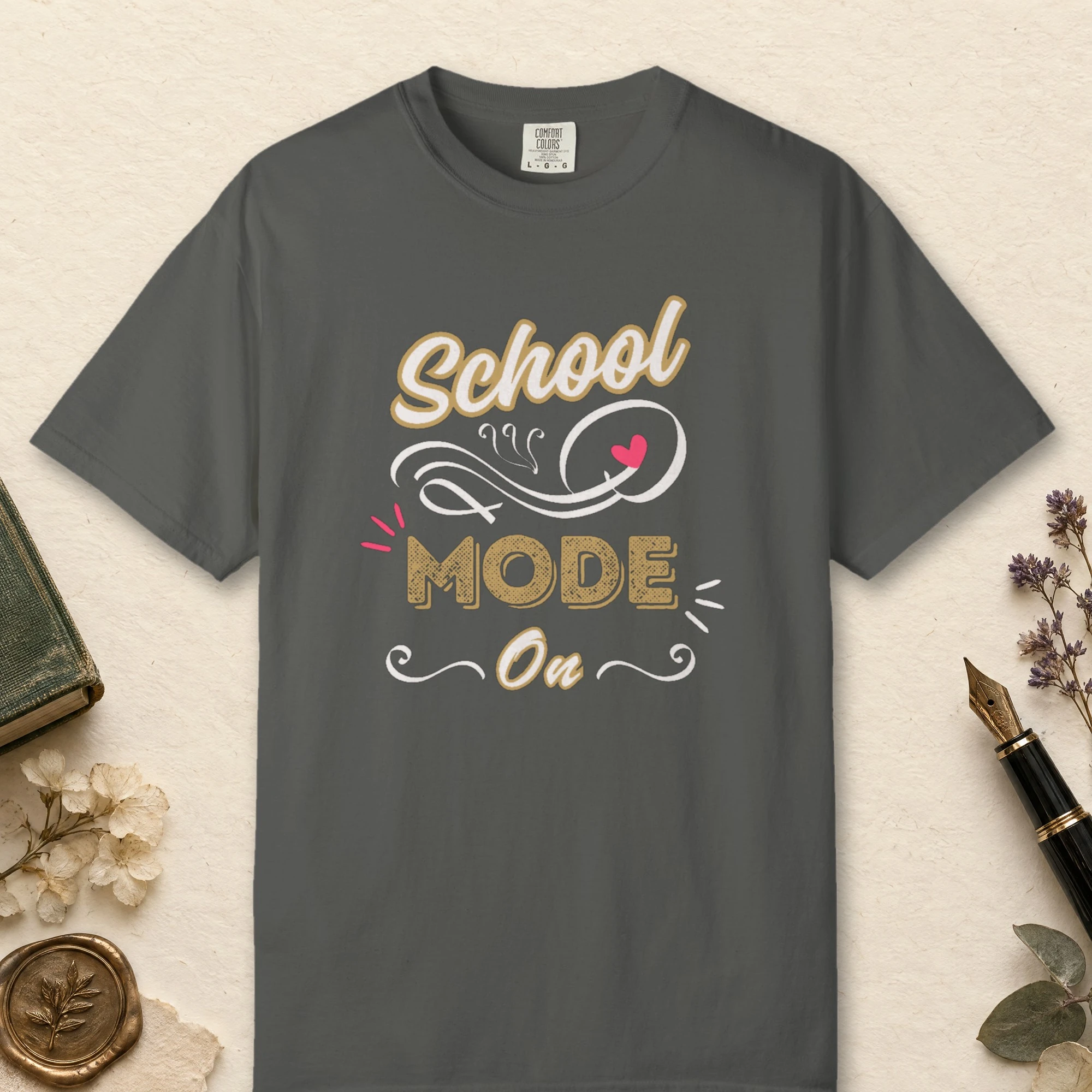 School Mode On design on a Pepper Comfort Colors 1717 tee, laid flat