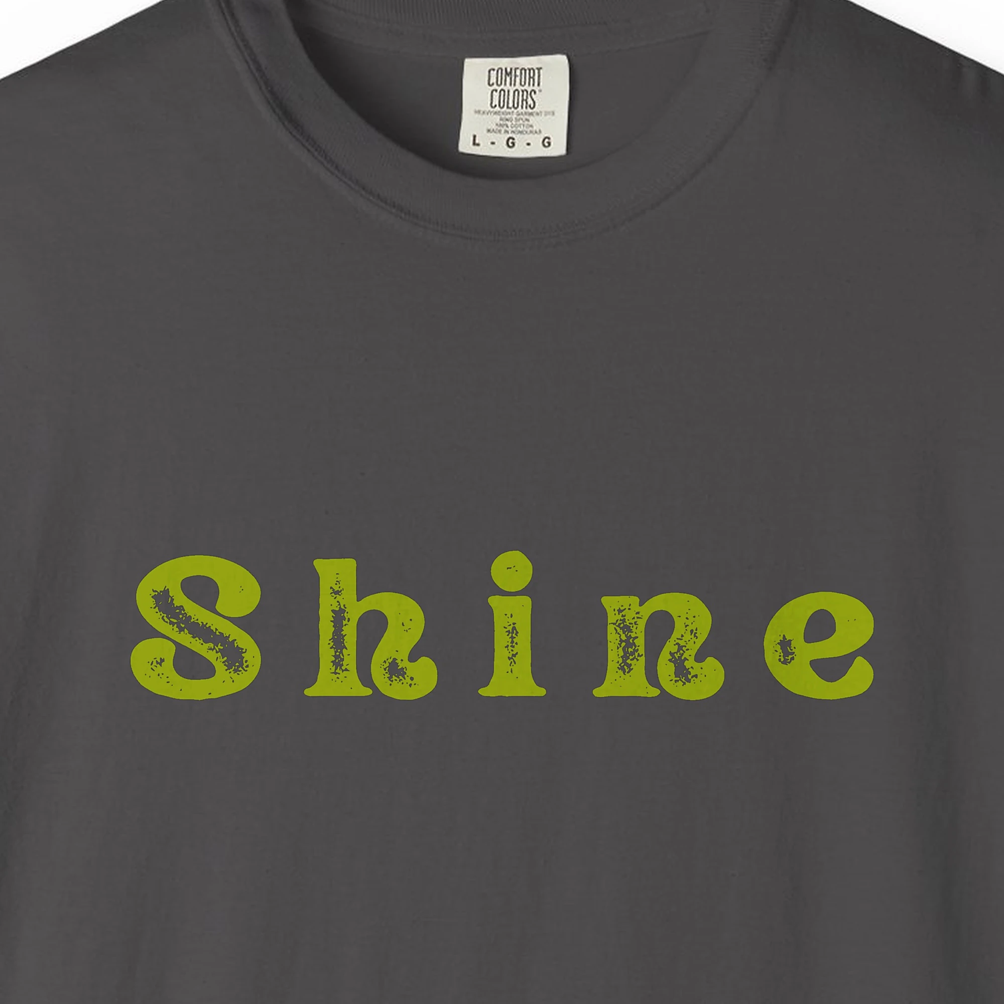 Close-up of the Shine print on a Graphite Comfort Colors 1717 tee