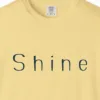 shine-wide-letter-tee-butter-chest Close-up of the Shine Wide Letter print on a Butter Comfort Colors 1717 tee