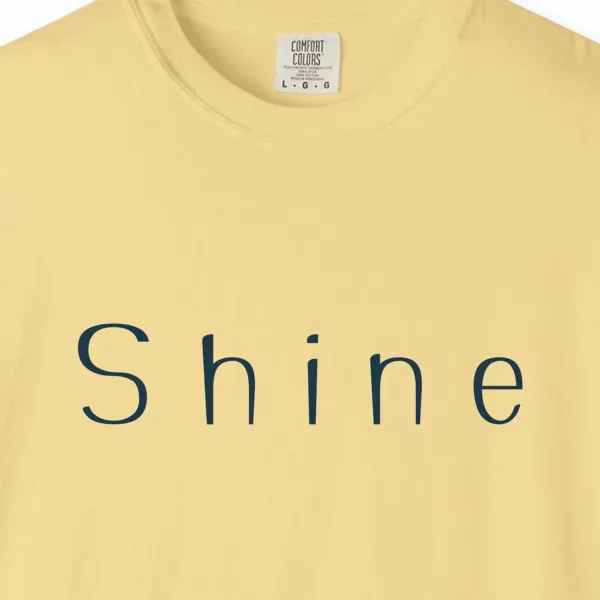 shine-wide-letter-tee-butter-chest Close-up of the Shine Wide Letter print on a Butter Comfort Colors 1717 tee