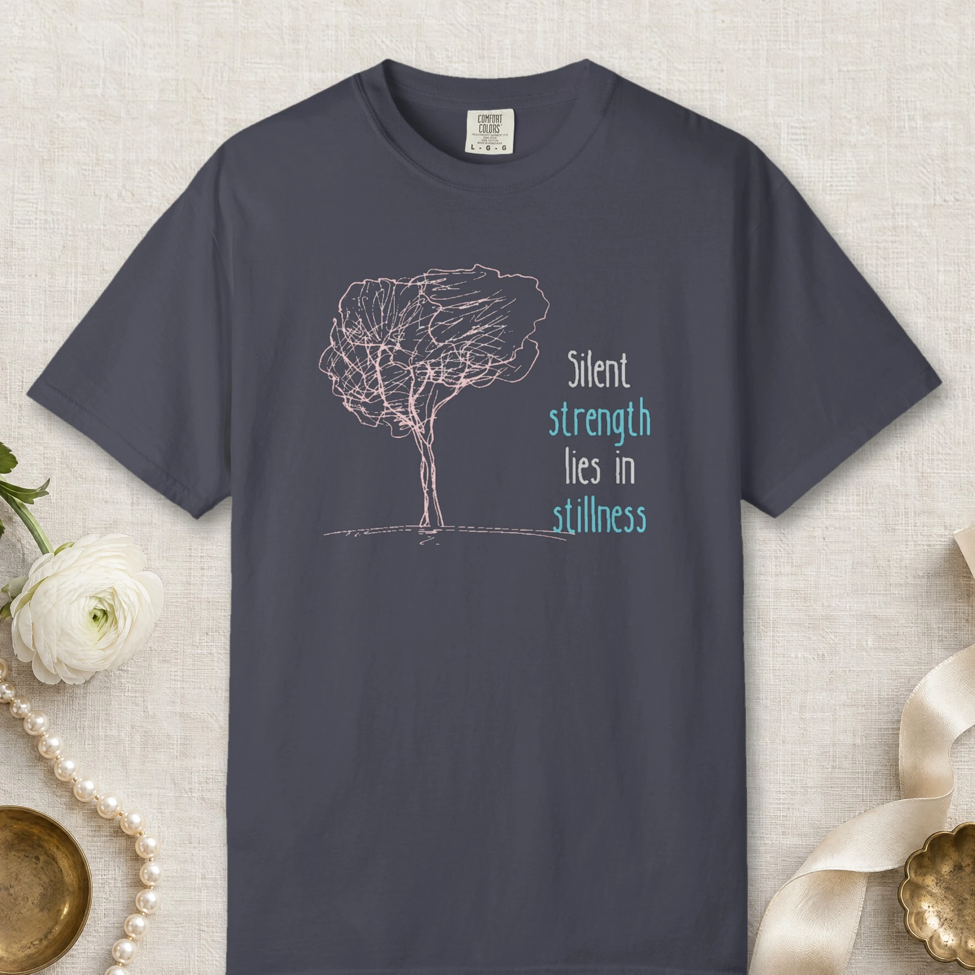 Silent Strength design on a Navy Comfort Colors 1717 tee, laid flat