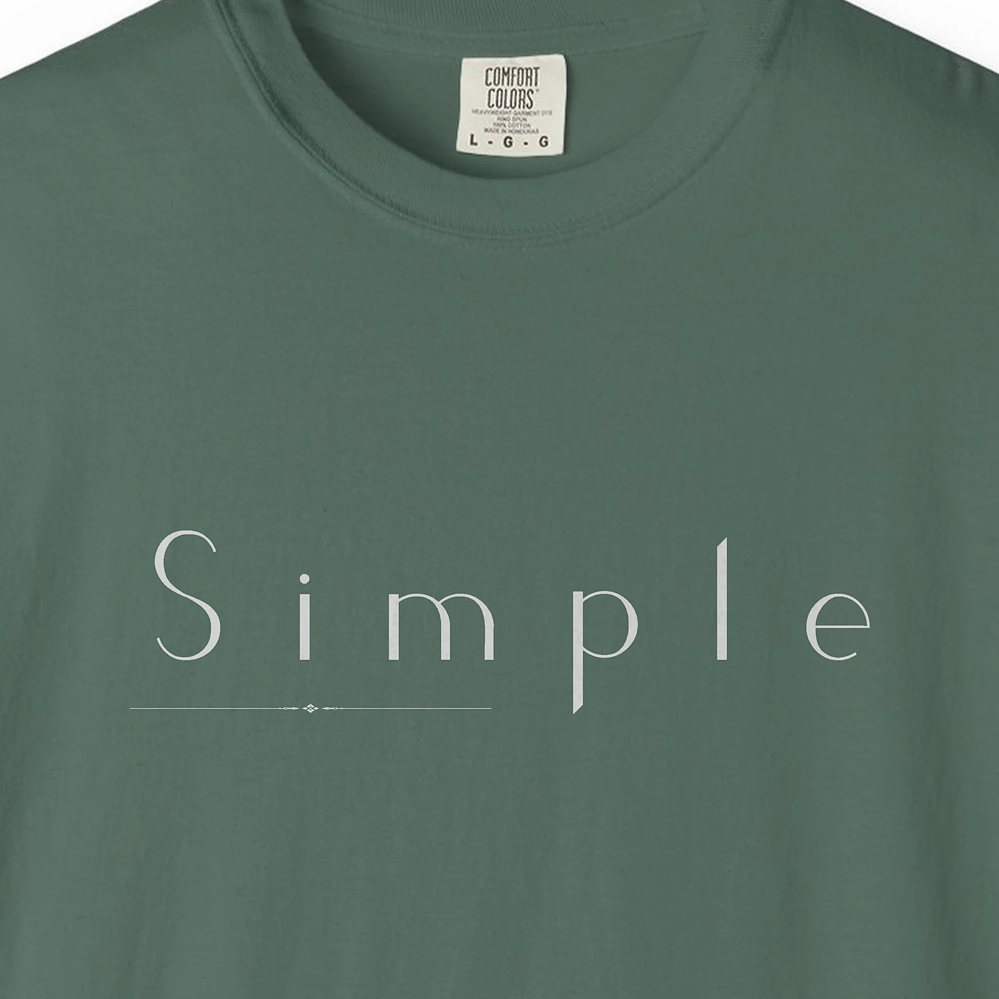 Close-up of the Simple Thin Line print on a Blue Spruce Comfort Colors 1717 tee