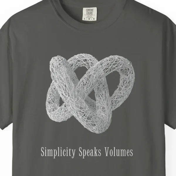 simplicity-speaks-volumes-tee-pepper-chest Close-up of the Simplicity Speaks Volumes print on a Pepper Comfort Colors 1717 tee