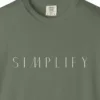 Close-up of the Simplify Spaced Capitals print on a Moss Comfort Colors 1717 tee