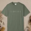 Simplify Spaced Capitals design on a Moss Comfort Colors 1717 tee, laid flat