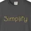 simplify-tee-graphite-chest Close-up of the Simplify print on a Graphite Comfort Colors 1717 tee