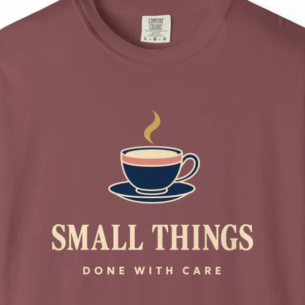 small-things-done-with-care-tee-brick-chest Close-up of the Small Things Done with Care print on a Brick Comfort Colors 1717 tee
