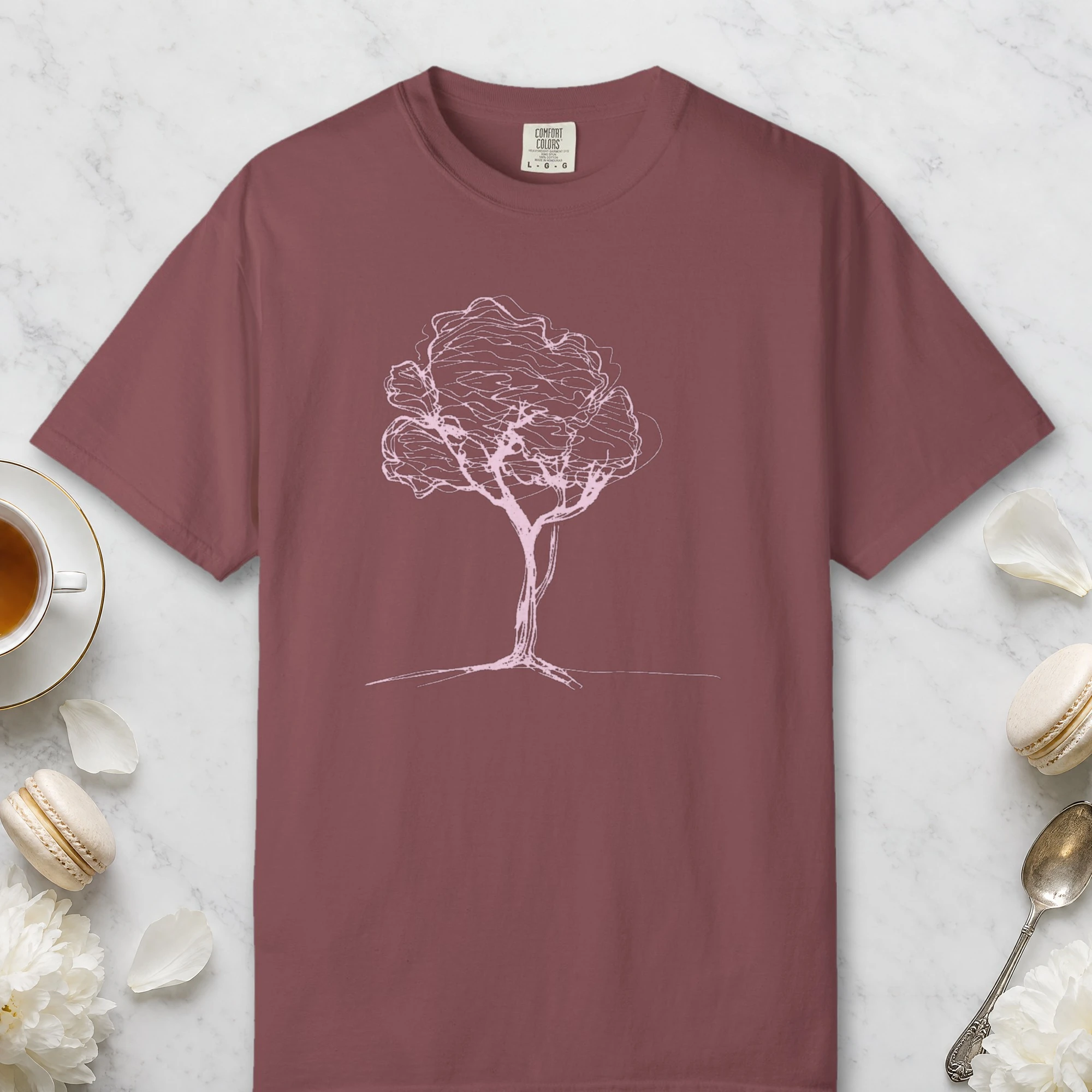 Soft Canopy Tree design on a Brick Comfort Colors 1717 tee, laid flat