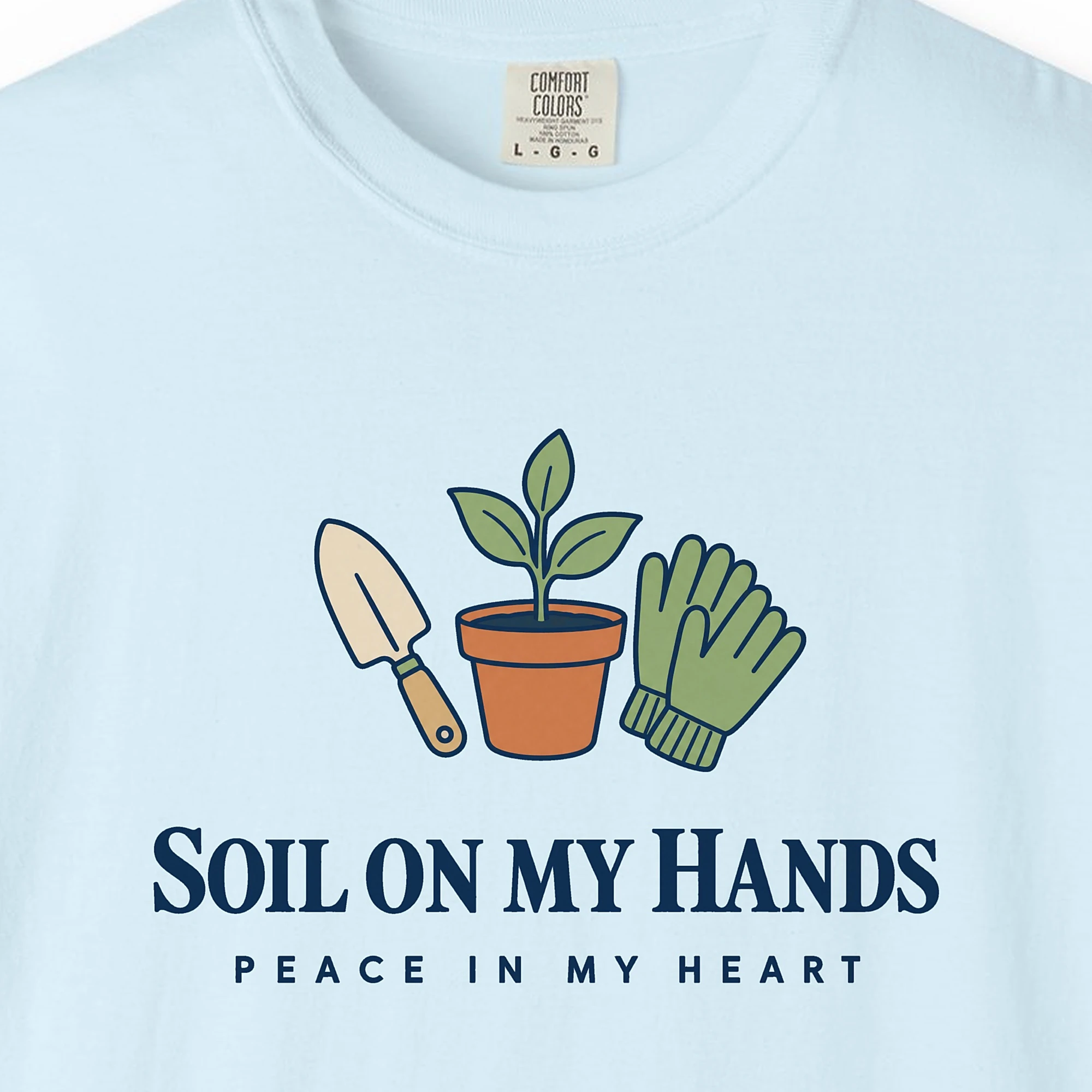 soil-on-my-hands-tee-chambray-chest Close-up of the Soil on My Hands print on a Chambray Comfort Colors 1717 tee