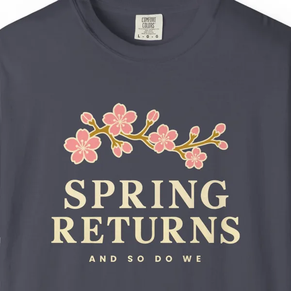 spring-returns-tee-navy-chest Close-up of the Spring Returns print on a Navy Comfort Colors 1717 tee