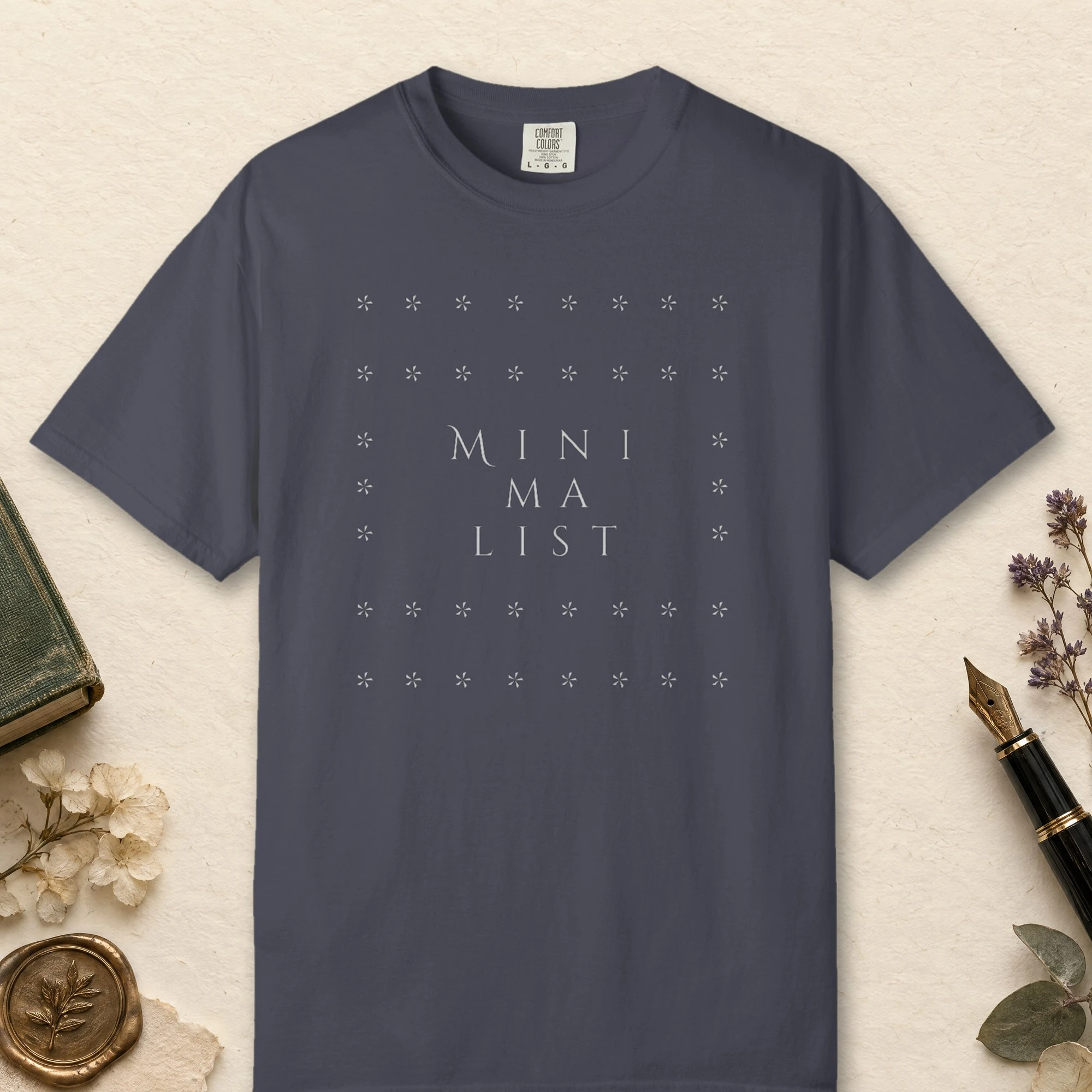 Star Frame Stack design on a Navy Comfort Colors 1717 tee, laid flat