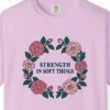 Close-up of the Strength in Soft Things print on a Orchid Comfort Colors 1717 tee