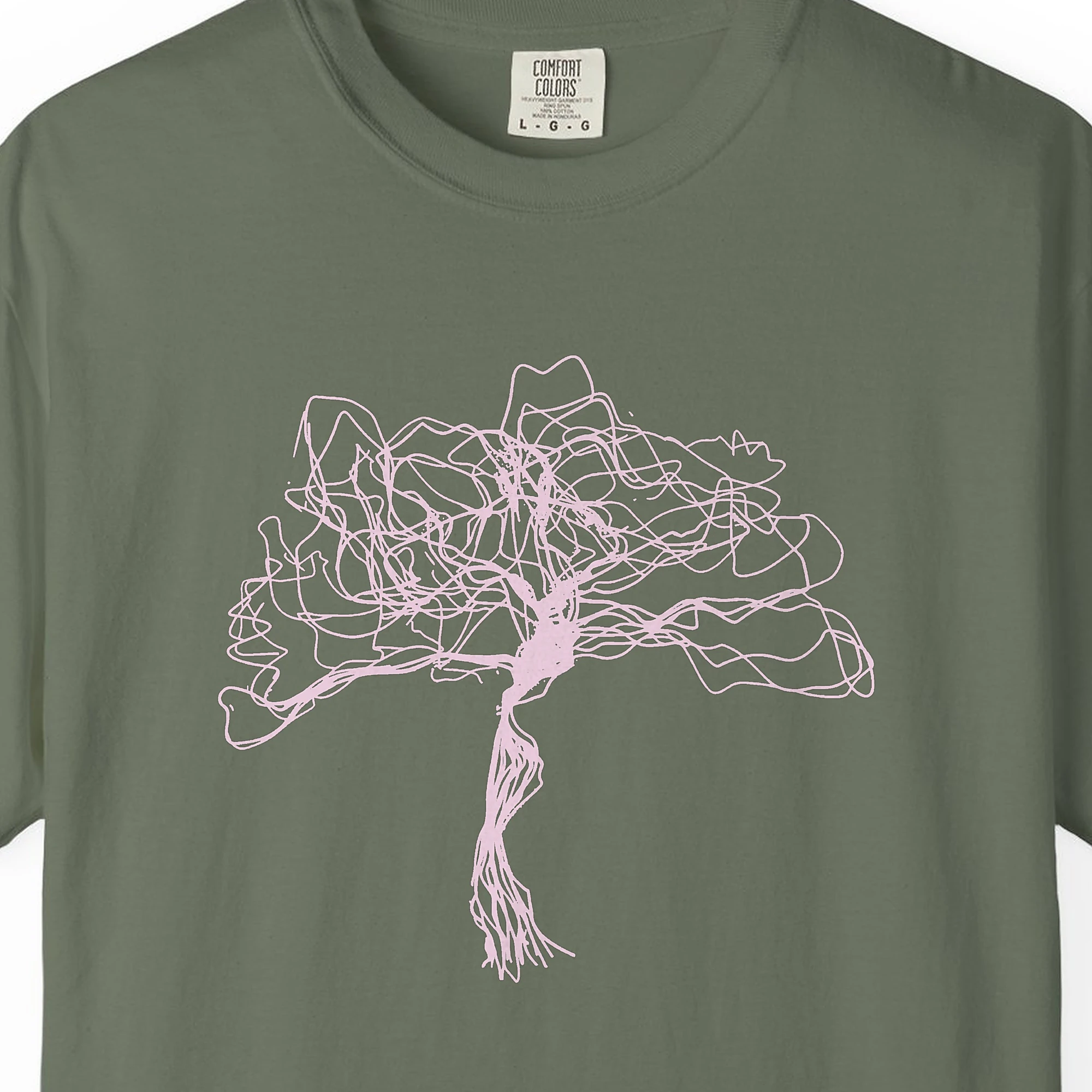 Close-up of the Tangled Crown Tree print on a Moss Comfort Colors 1717 tee