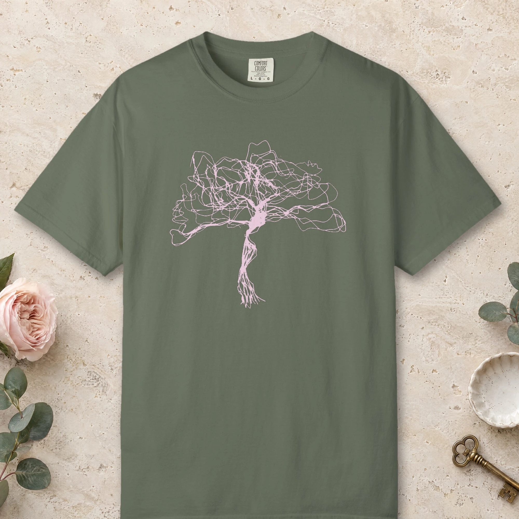 Tangled Crown Tree design on a Moss Comfort Colors 1717 tee, laid flat