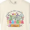 Close-up of the Teacher in Bloom print on a Ivory Comfort Colors 1717 tee