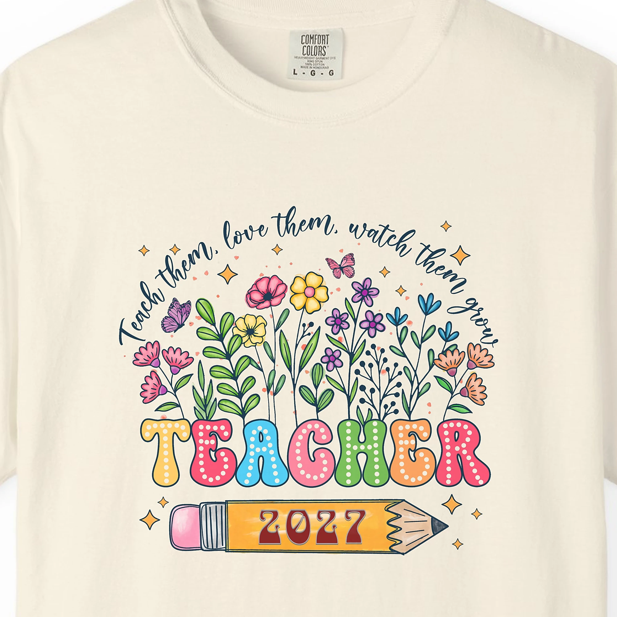 Close-up of the Teacher in Bloom print on a Ivory Comfort Colors 1717 tee