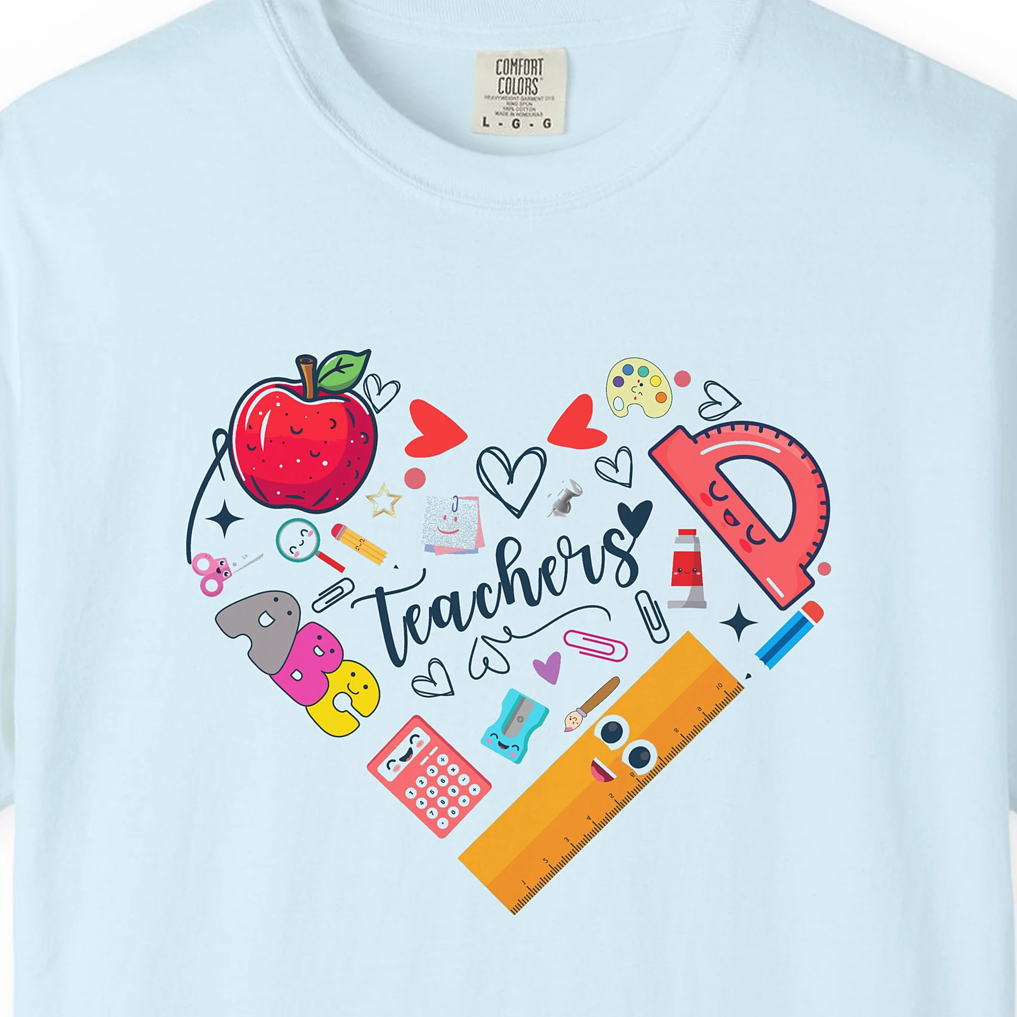Close-up of the Teachers Heart print on a Chambray Comfort Colors 1717 tee