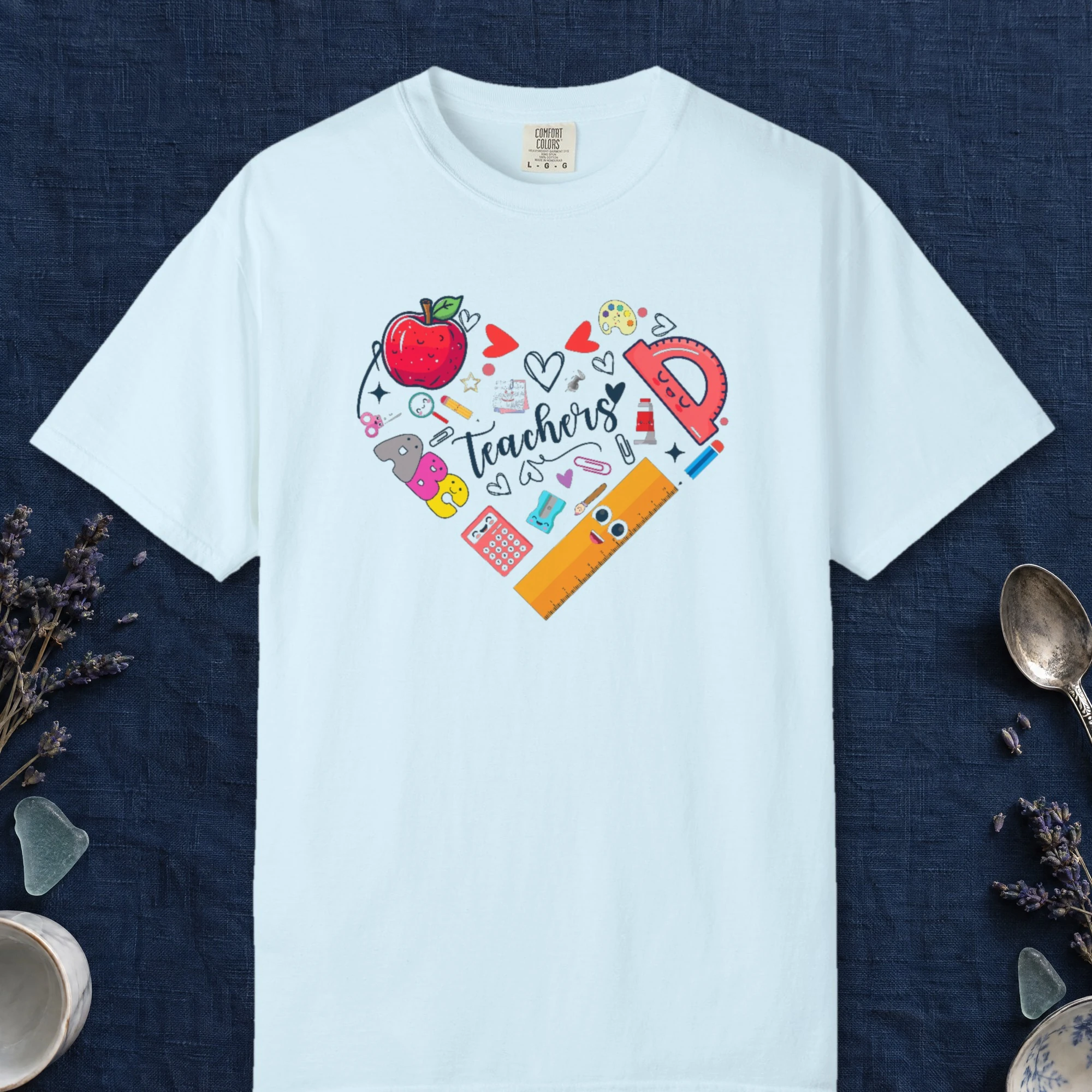 Teachers Heart design on a Chambray Comfort Colors 1717 tee, laid flat