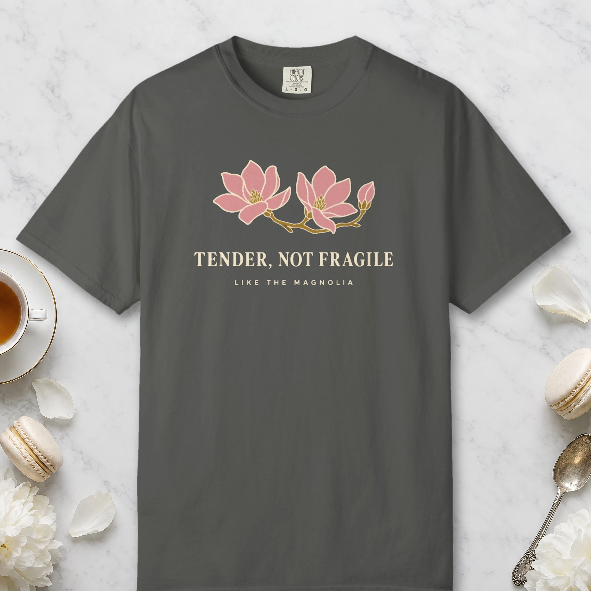 Tender Not Fragile design on a Pepper Comfort Colors 1717 tee, laid flat