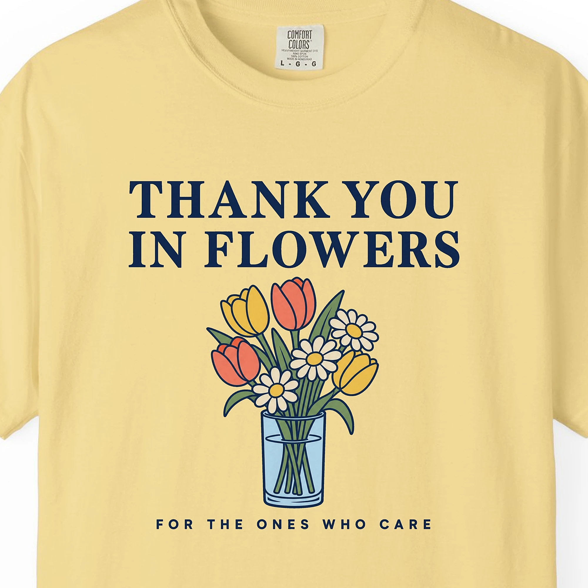 Close-up of the Thank You in Flowers print on a Butter Comfort Colors 1717 tee