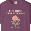 Close-up of the The Rose Takes Its Time print on a Berry Comfort Colors 1717 tee