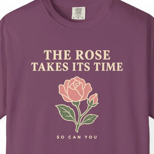 Close-up of the The Rose Takes Its Time print on a Berry Comfort Colors 1717 tee