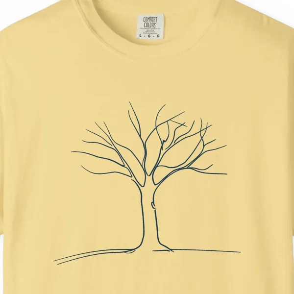 Close-up of the Tree on a Quiet Hill print on a Butter Comfort Colors 1717 tee