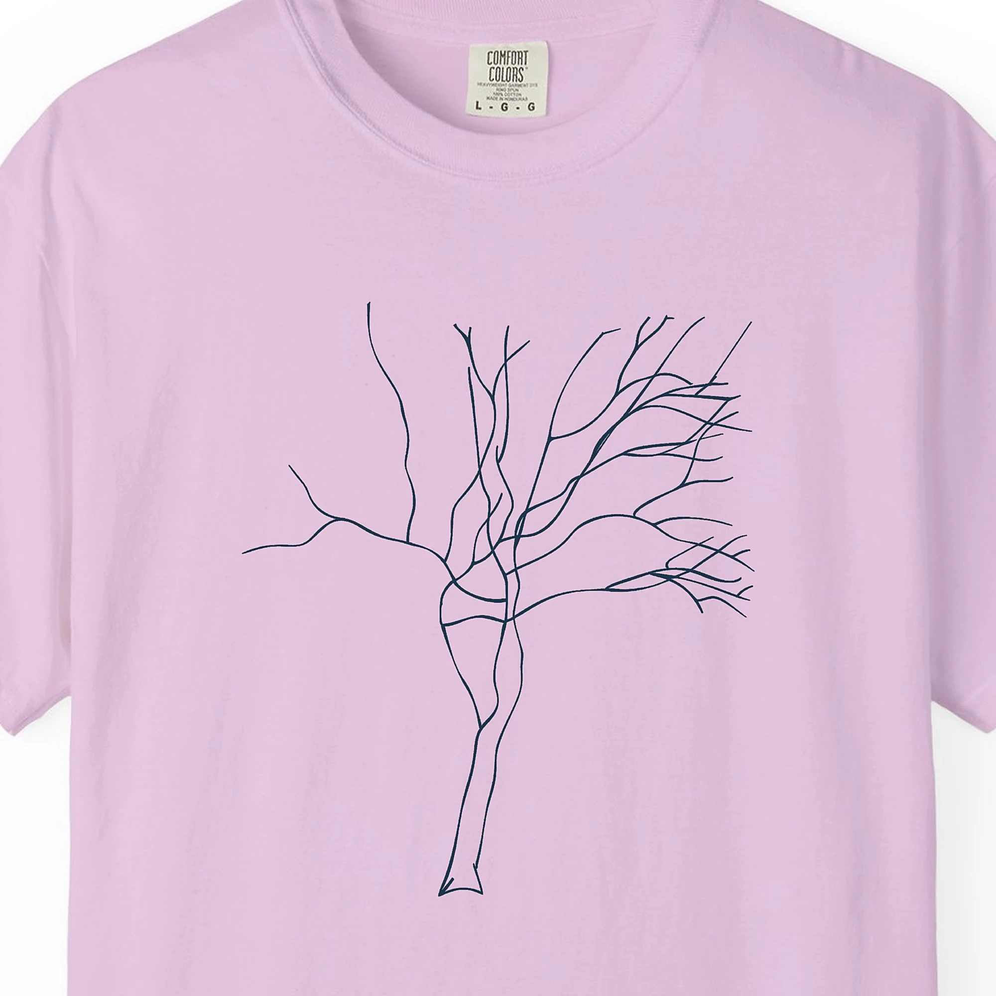 Close-up of the Twisting Trunk print on a Orchid Comfort Colors 1717 tee