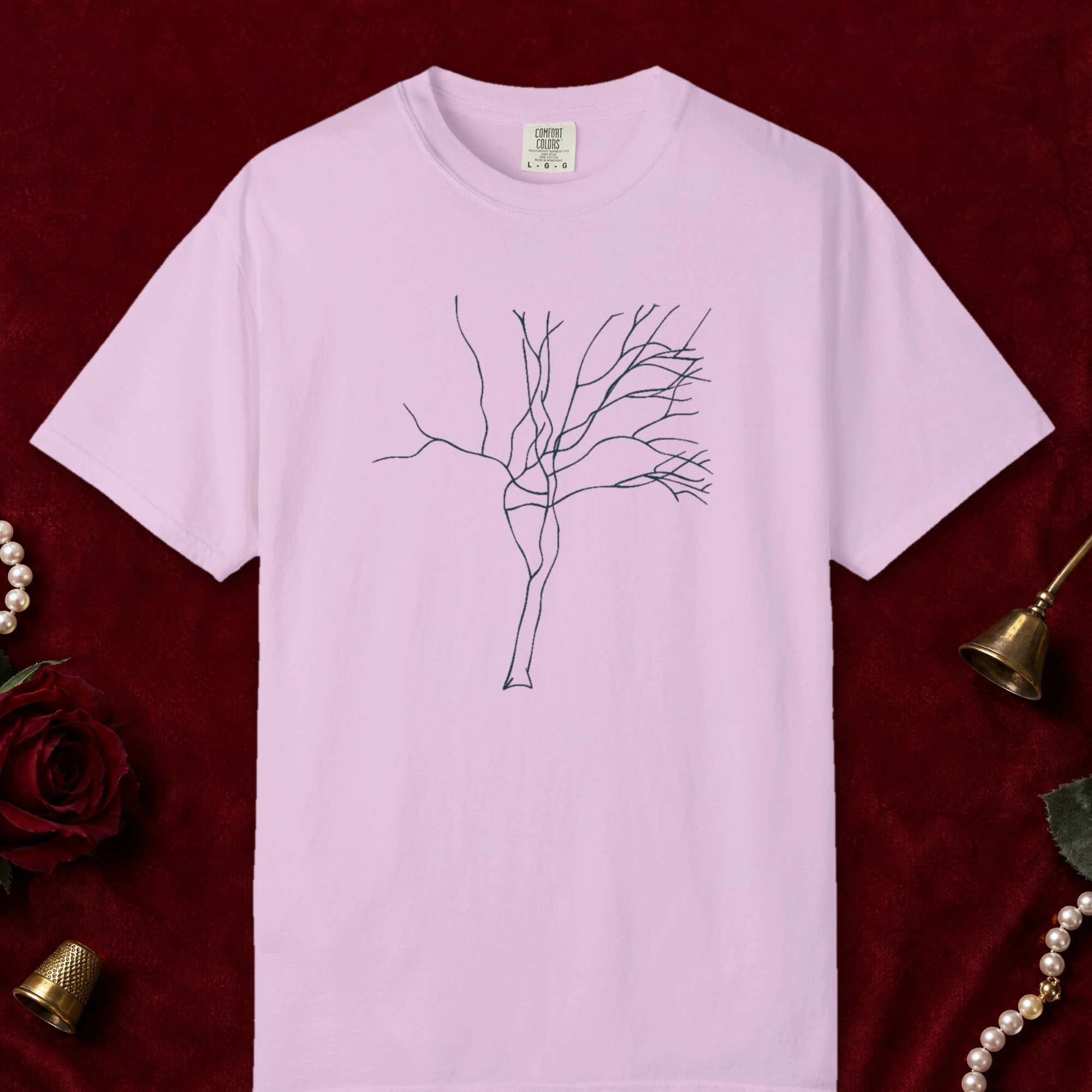 Twisting Trunk design on a Orchid Comfort Colors 1717 tee, laid flat