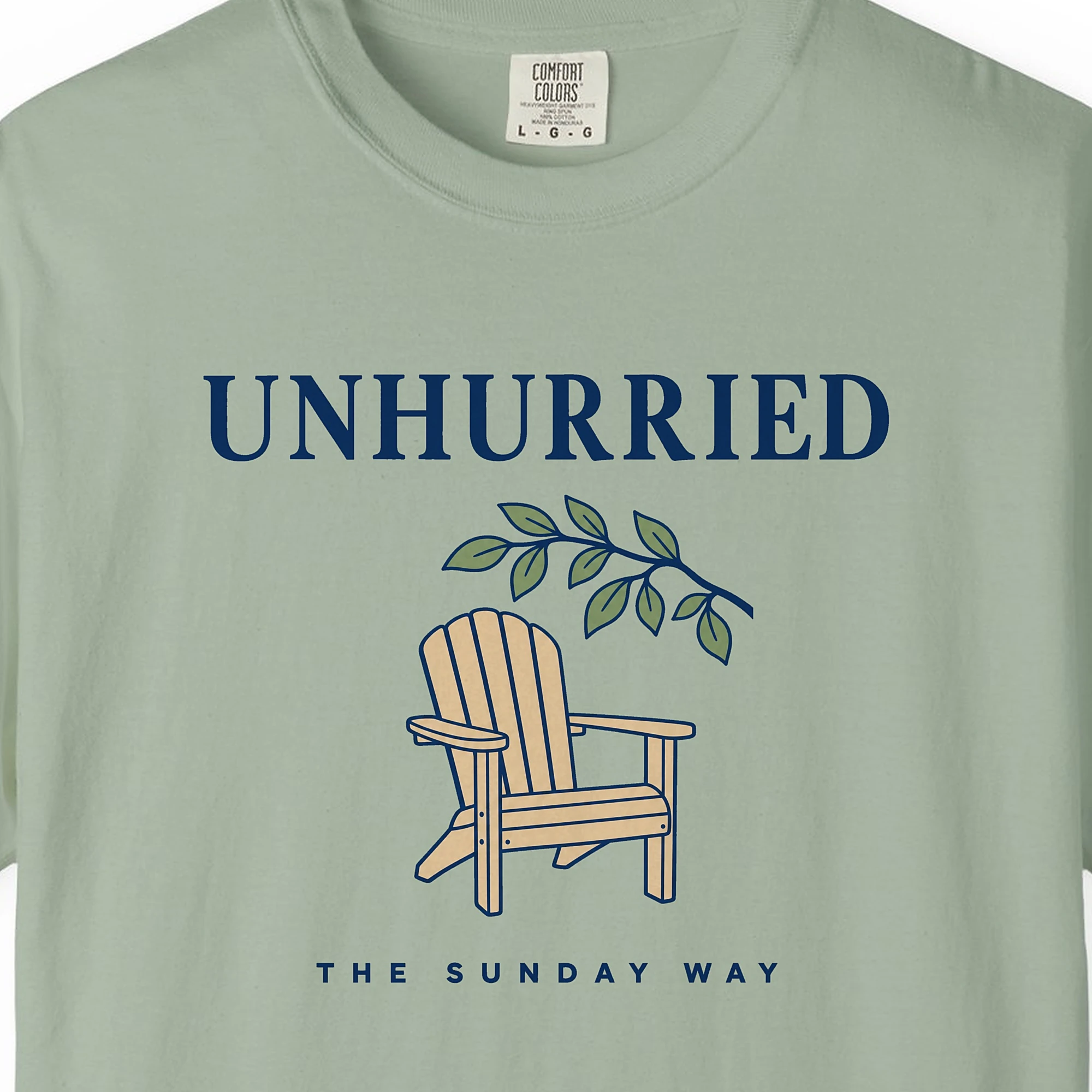 Close-up of the Unhurried Sunday print on a Bay Comfort Colors 1717 tee