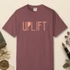 uplift-tee-brick-front Uplift design on a Brick Comfort Colors 1717 tee, laid flat