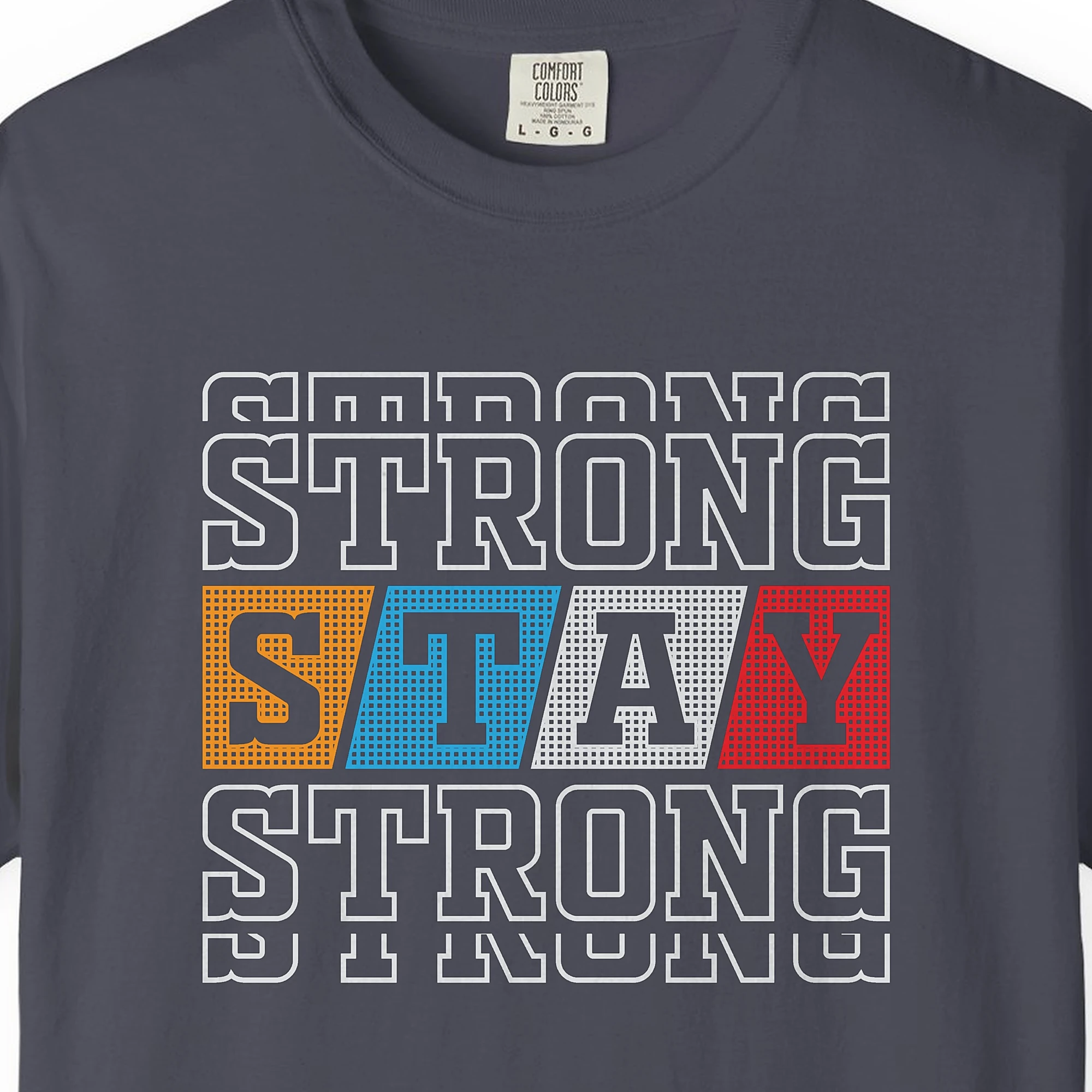 Close-up of the Varsity Strength print on a Navy Comfort Colors 1717 tee