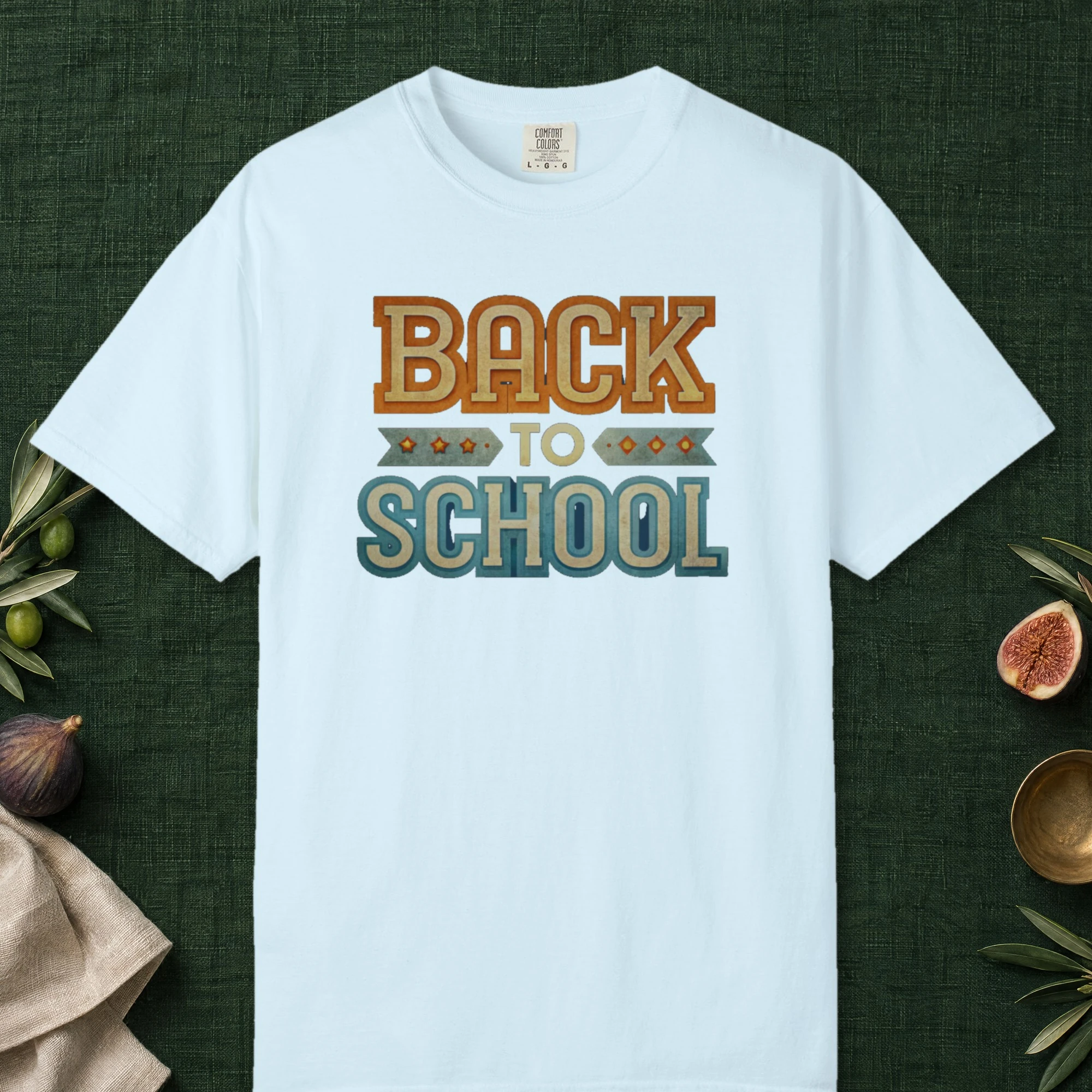 Vintage Back to School design on a Chambray Comfort Colors 1717 tee, laid flat