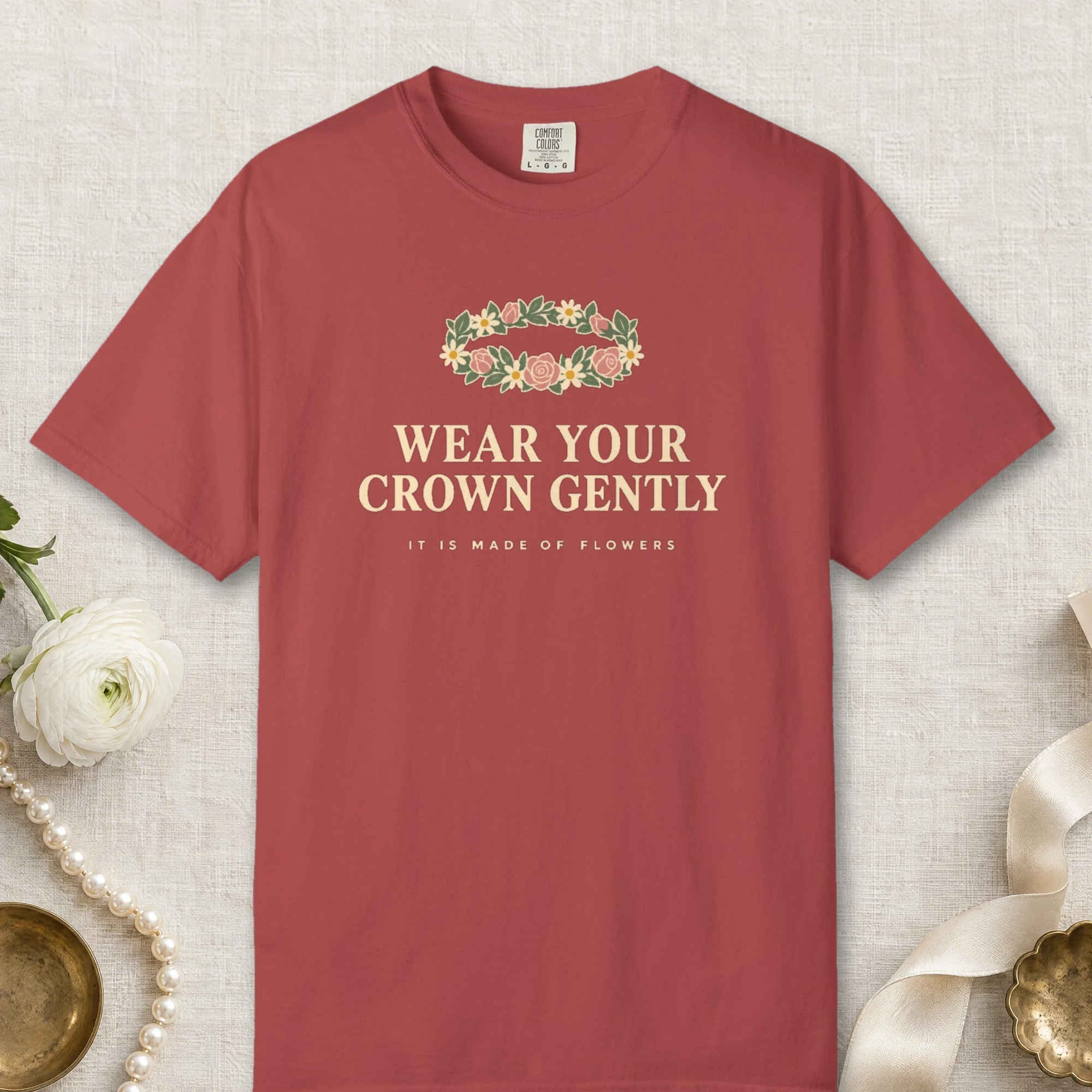 Wear Your Crown Gently design on a Crimson Comfort Colors 1717 tee, laid flat