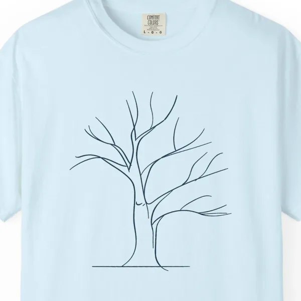 Close-up of the Wide Winter Tree print on a Chambray Comfort Colors 1717 tee