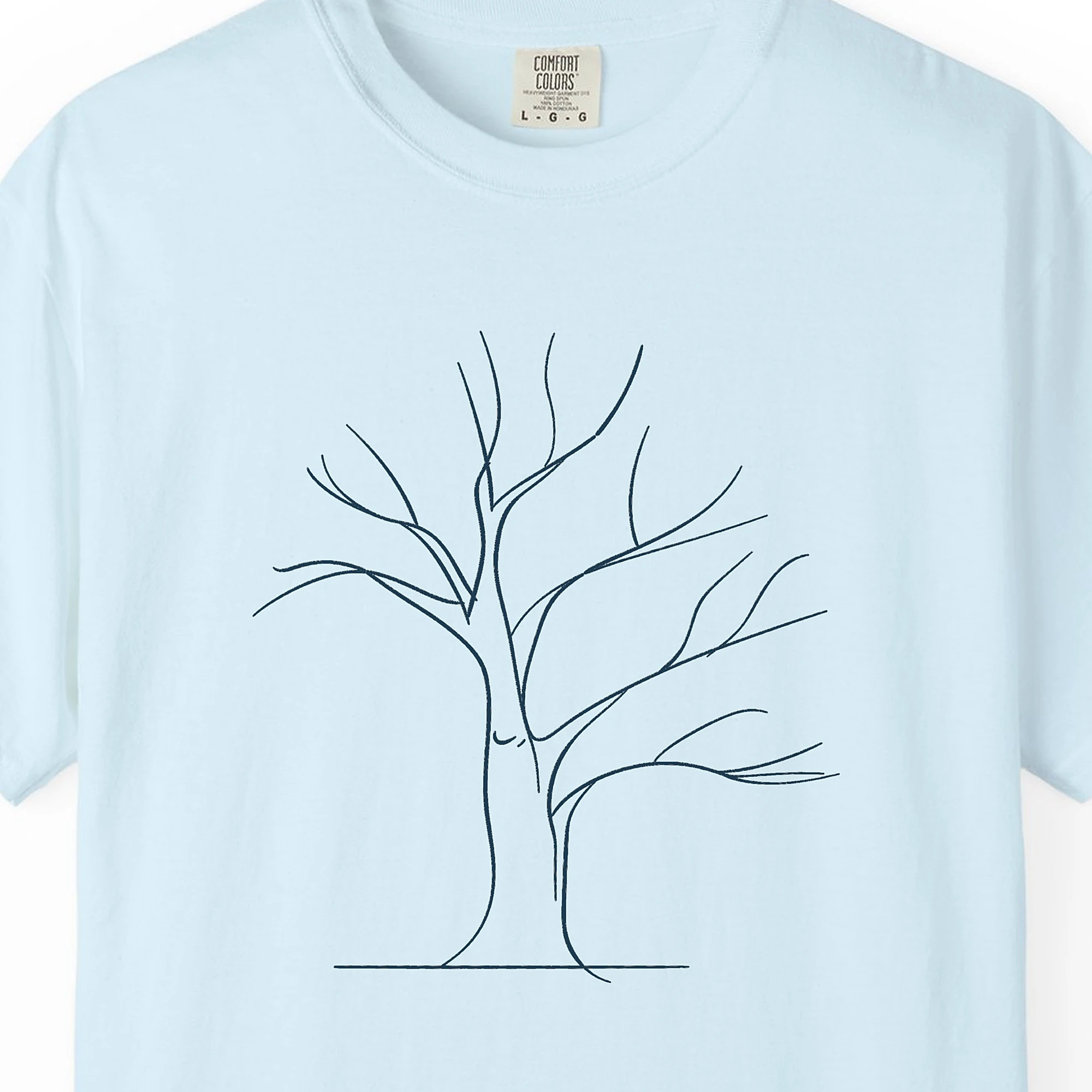 wide-winter-tree-tee-chambray-chest Close-up of the Wide Winter Tree print on a Chambray Comfort Colors 1717 tee