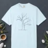 Wide Winter Tree design on a Chambray Comfort Colors 1717 tee, laid flat
