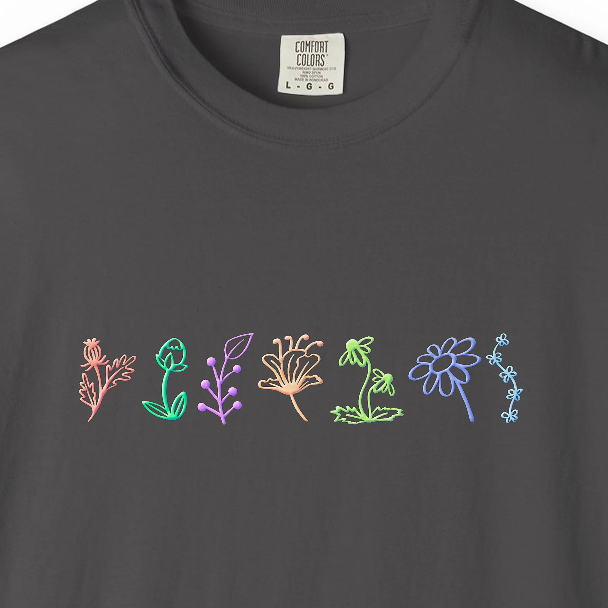 Close-up of the Wildflower Row print on a Graphite Comfort Colors 1717 tee