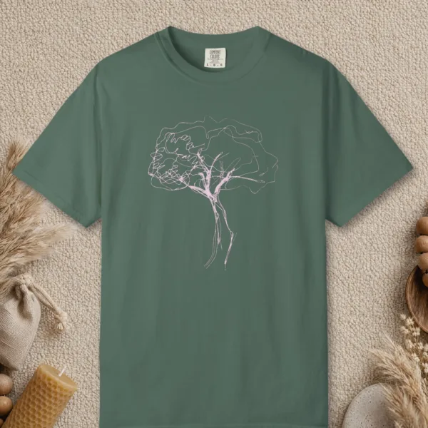 Windswept Tree design on a Blue Spruce Comfort Colors 1717 tee, laid flat
