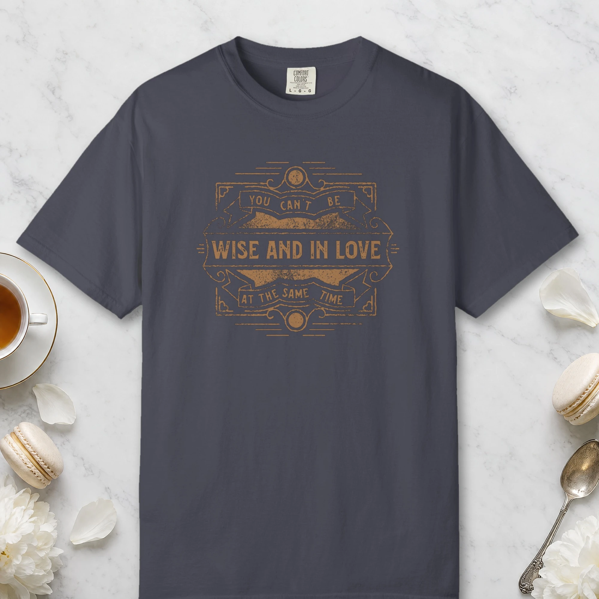 Wise and in Love design on a Navy Comfort Colors 1717 tee, laid flat